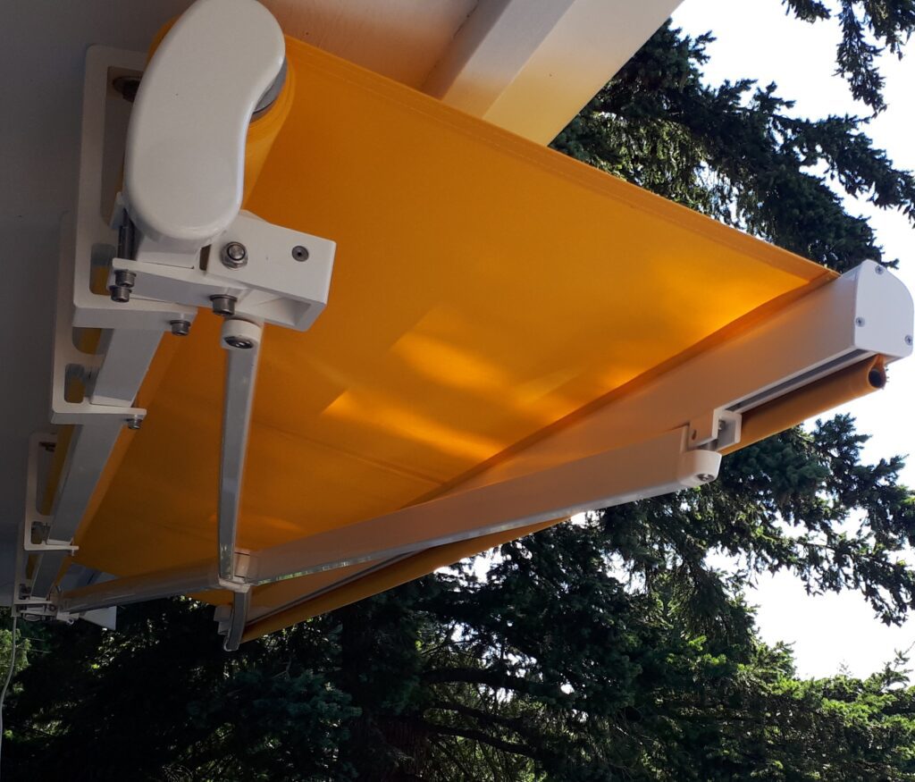 retractable-awning-yellow-fabric-soffit-brackets