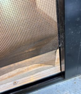 stowaway-retractable-screen-mesh-torn-at-slide-bar
