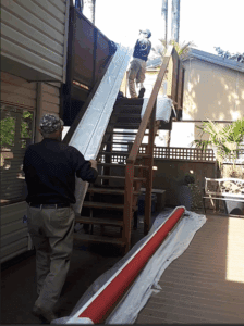 white-frame-red-fabric-retractable-awning-installation