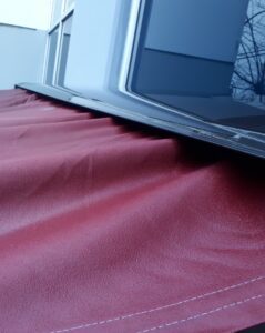 wrinkled-awning-uneven-fabric-snow-damage