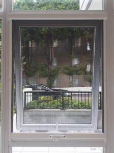 stowaway-retractable-window-screen-closed-white-awning-window-open